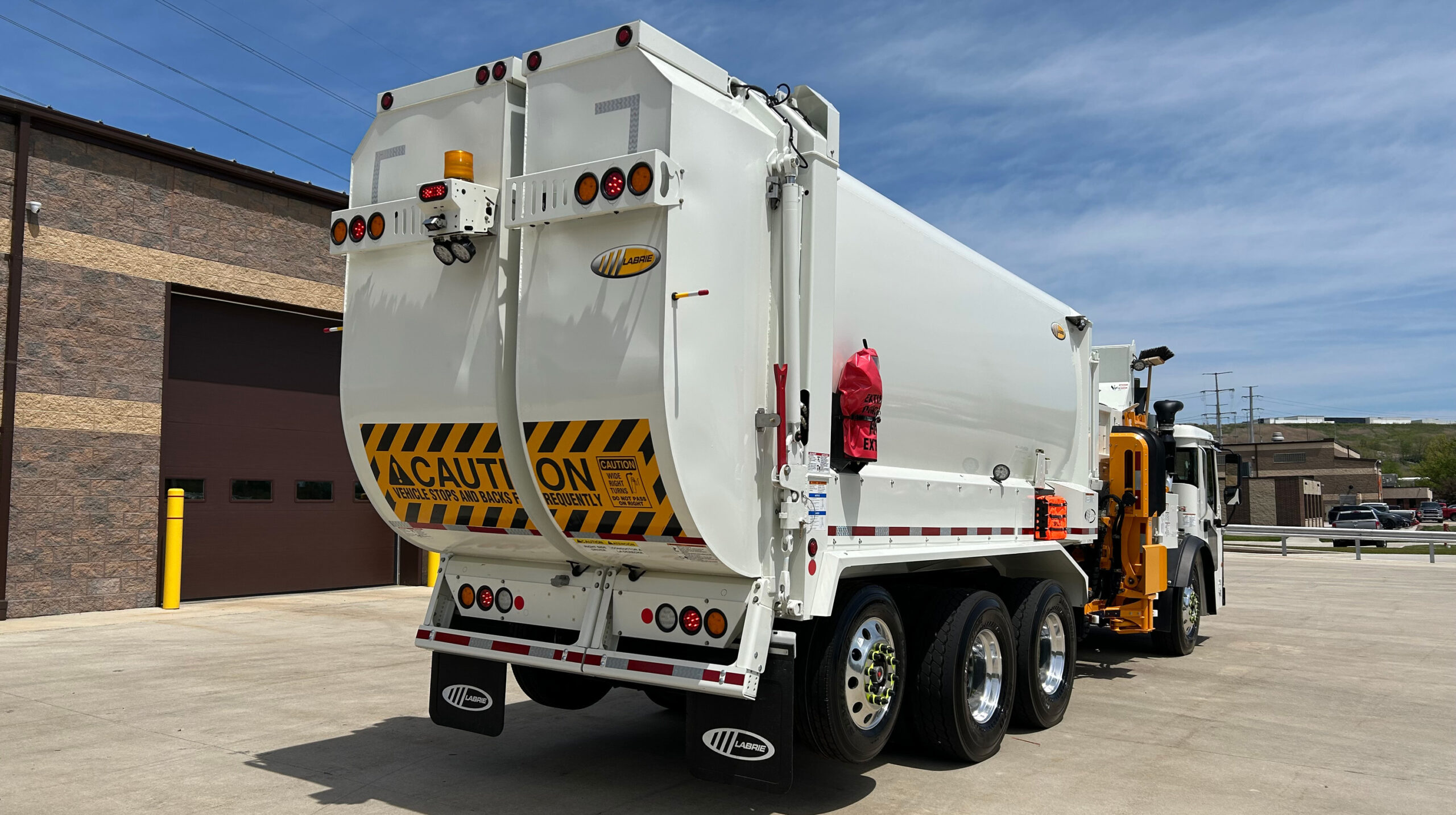 Apex Waste Solutions split-body truck showing two separate compartments